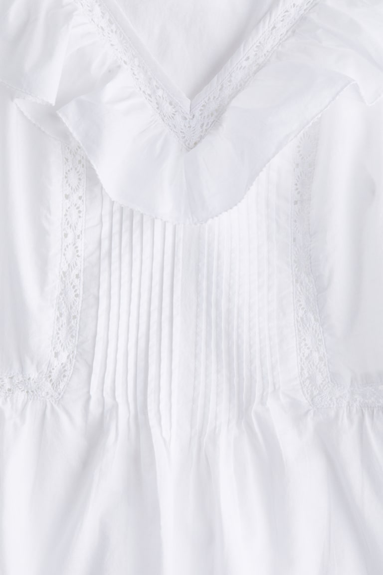 H&M Baumwolltop mit Volant Tiefpreis