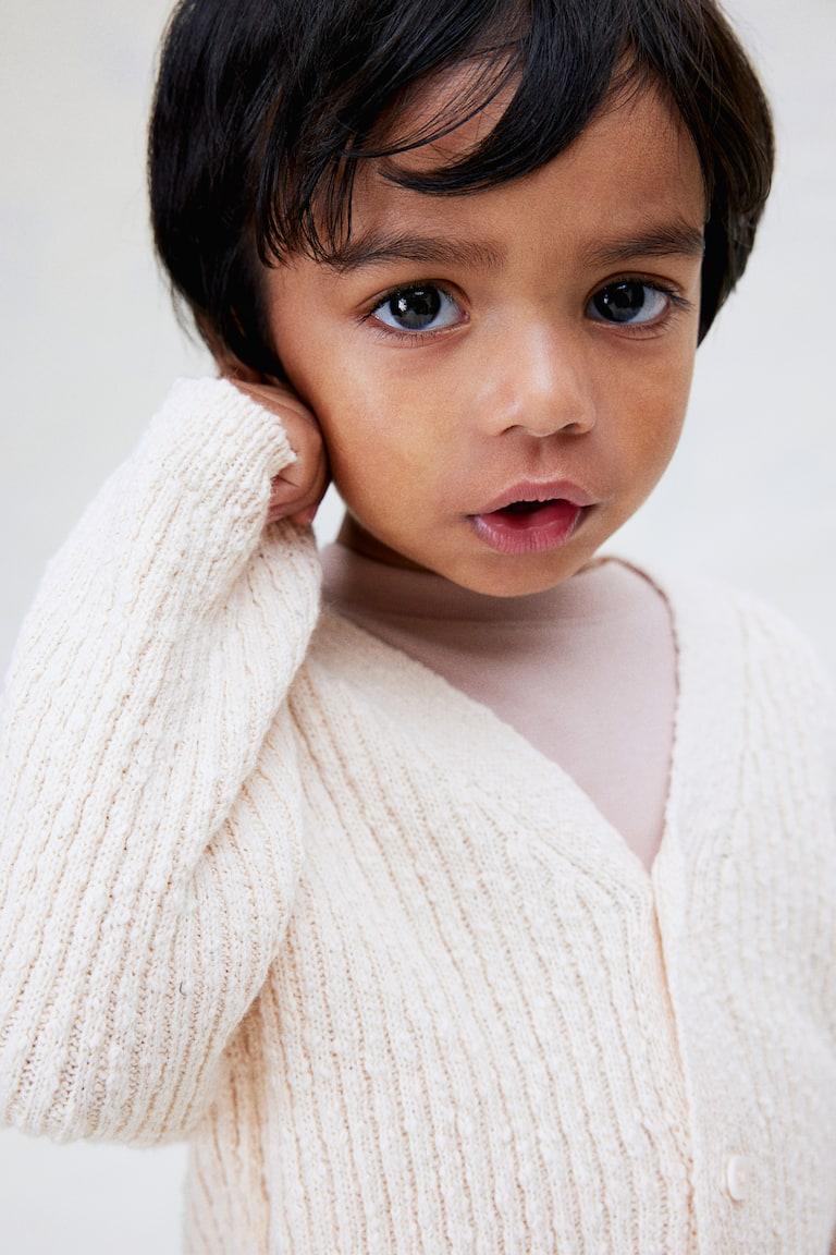 H&M Oversized Cardigan aus Boucléstrick Große Rabatte