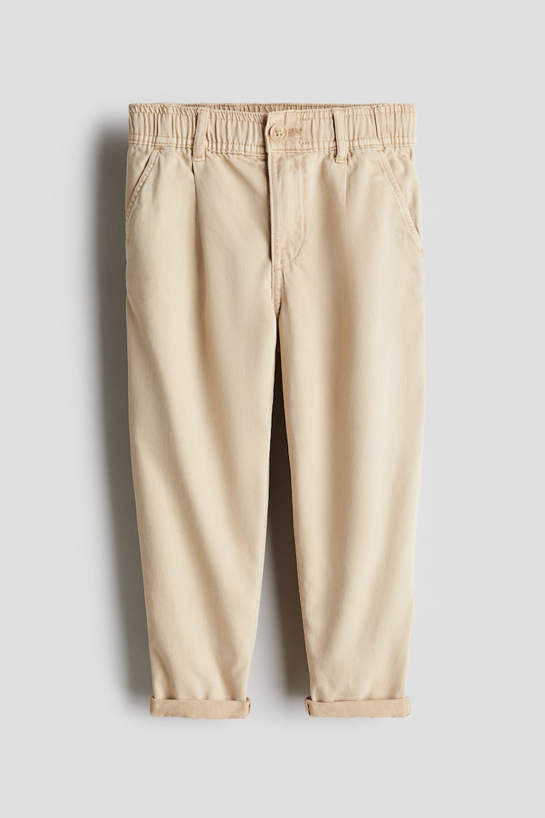 H&M Loose-fit tapered twill chinos Neuheiten