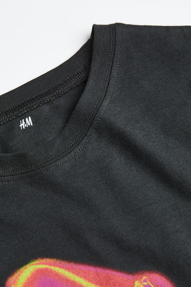 H&M Baumwoll-T-Shirt mit Print Tiefpreis